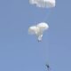 Parachutes of paratroopers performing emergency jumping got entangled in the air