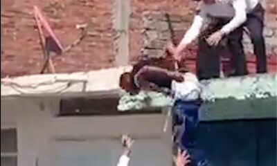 The effort of the police to take down the criminal they caught on the roof from the roof