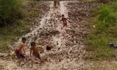 PK 0048 Poor kids having fun in mud