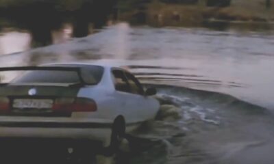 The car without the handbrake slipped into the water when pushed